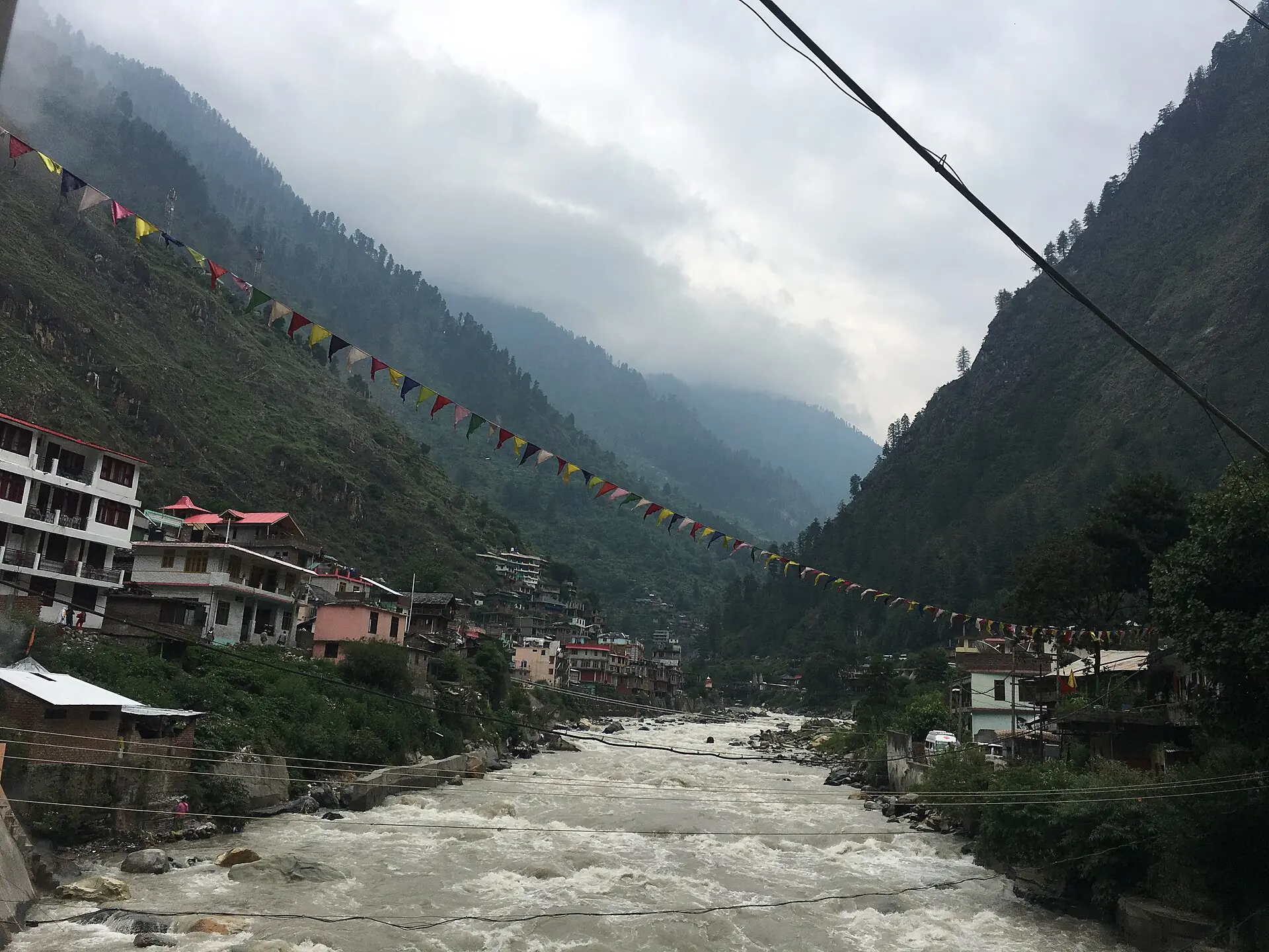 The Parvati river flowing past buildings at Manikaran Sahib