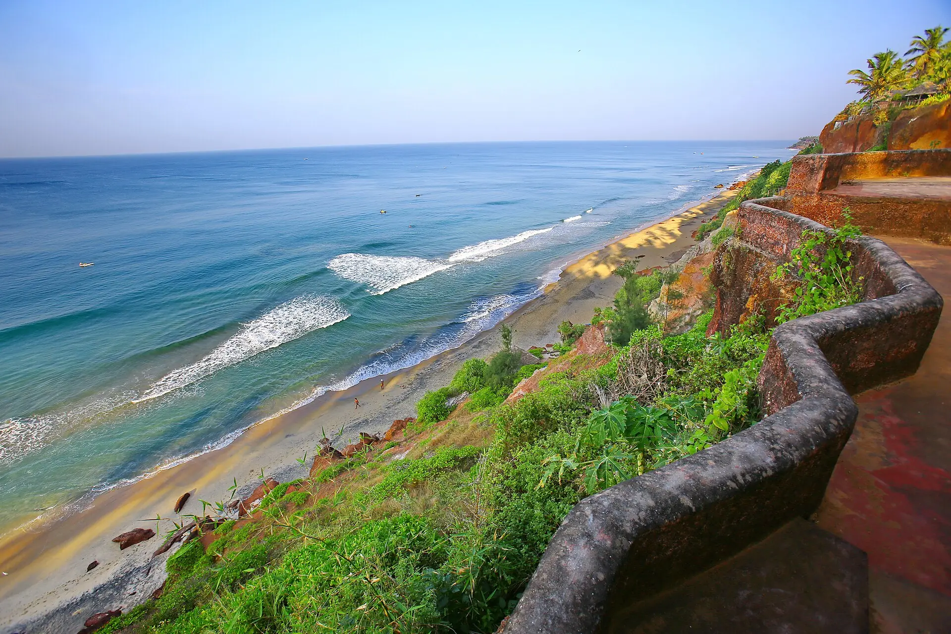 Red laterite cliff path above the surf at Varkala beach